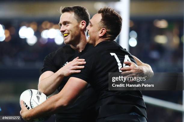 Israel Dagg celebrates with Ben Smith of the All Blacks after scoring a try during the International Test match between the New Zealand All Blacks...