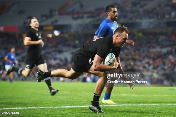 Israel Dagg of the All Blacks dives over to score a try during the International Test match between the New Zealand All Blacks and Samoa at Eden Park...