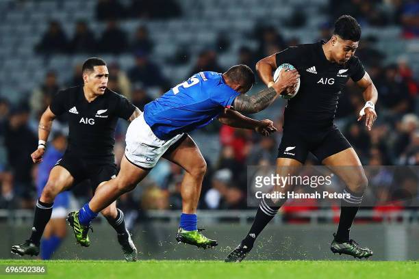 Julian Savea of the All Blacks makes a break during the International Test match between the New Zealand All Blacks and Samoa at Eden Park on June...