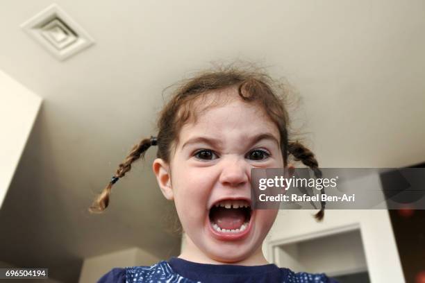 small girl screaming at home - grittywomantrend stock pictures, royalty-free photos & images