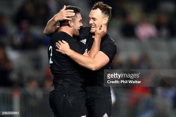 Codie Taylor is congratulated on his try by Israel Dagg during the International Test match between the New Zealand All Blacks and Samoa at Eden Park...