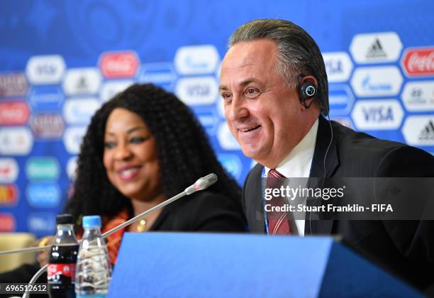 Fatma Samoura, FIFA Secretary General looks over at Vitaly Mutko, Russian Deputy Prime Minister as he talks to the media during the opening press...