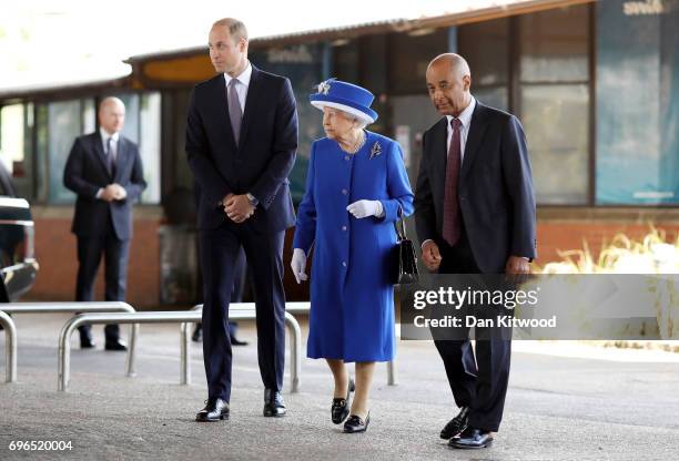 Queen Elizabeth II and Prince William, Duke of Cambridge visit the scene of the Grenfell Tower fire on June 16, 2017 in London, England. 17 people...