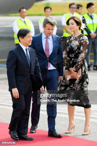 Crown Prince Naruhito is welcomed by Crown Prince Frederik and Crown Princess Mary of Denmark on arrival at Copenhagen Airport on June 15, 2017 in...