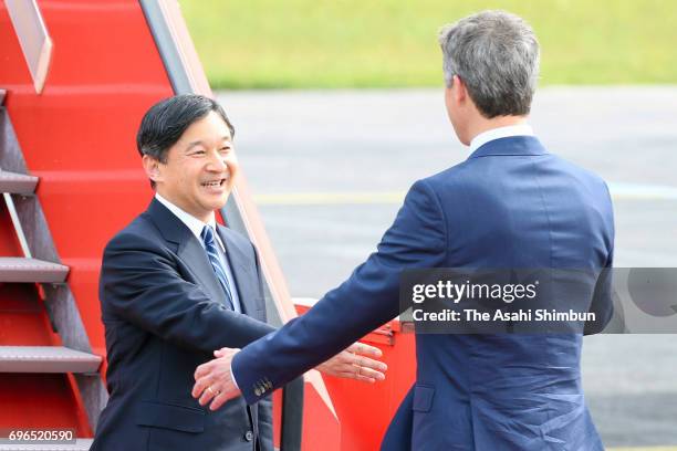 Crown Prince Naruhito is welcomed by Crown Prince Frederik and Crown Princess Mary of Denmark on arrival at Copenhagen Airport on June 15, 2017 in...