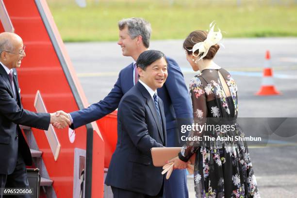 Crown Prince Naruhito is welcomed by Crown Prince Frederik and Crown Princess Mary of Denmark on arrival at Copenhagen Airport on June 15, 2017 in...