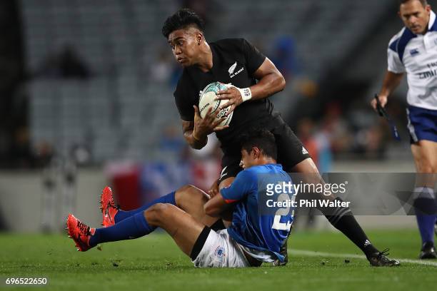 Julian Savea of the All Blacks is tackled during the International Test match between the New Zealand All Blacks and Samoa at Eden Park on June 16,...