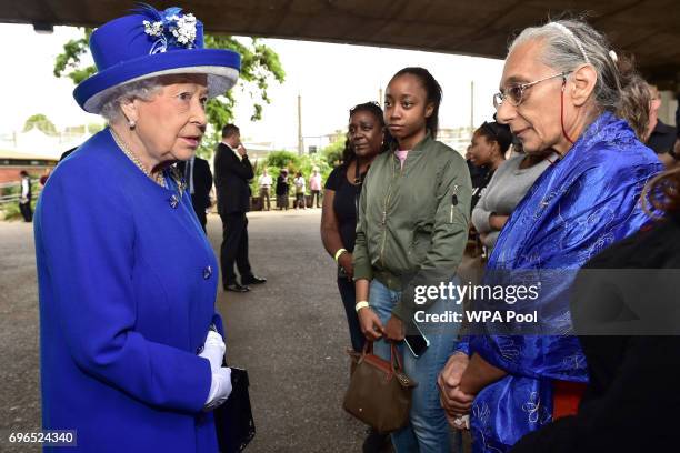 Queen Elizabeth II meets members of the community affected by the fire at Grenfell Tower in west London during a visit to the Westway Sports Centre...