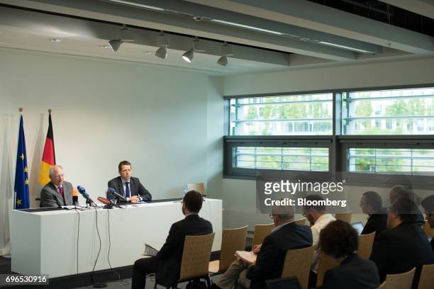 Wolfgang Schaeuble, Germany's finance minister, left, speaks during a news conference at an Ecofin meeting of European Union finance ministers in...