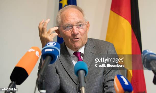 Wolfgang Schaeuble, Germany's finance minister, gestures while speaking during a news conference at an Ecofin meeting of European Union finance...
