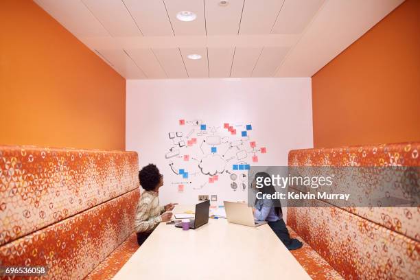 work colleagues brainstorming in creative office - symmetry stock pictures, royalty-free photos & images