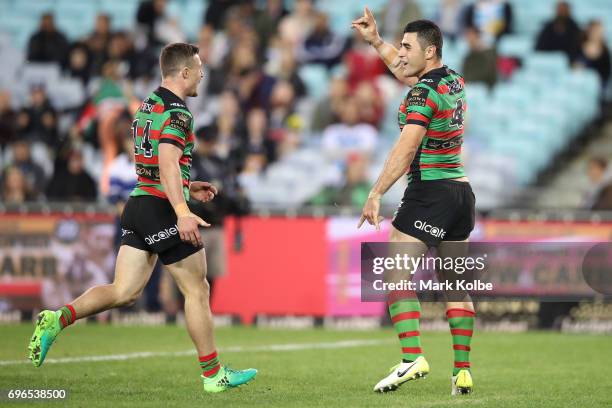 Damien Cook and Bryson Goodwin of the Rabbitohs celebrate Goodwin scoring a try during the round 15 NRL match between the South Sydney Rabbitohs and...