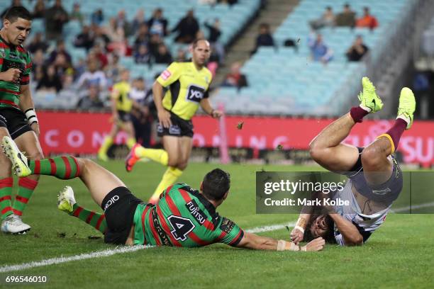 Konrad Hurrell of the Titans flips after he dived to ground the ball during the round 15 NRL match between the South Sydney Rabbitohs and the Gold...
