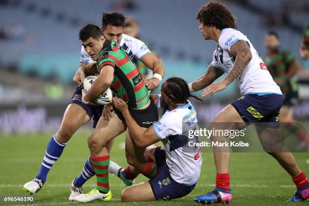 Bryson Goodwin of the Rabbitohs is tackled during the round 15 NRL match between the South Sydney Rabbitohs and the Gold Coast Titans at ANZ Stadium...