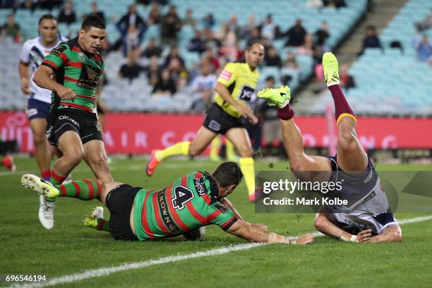 Konrad Hurrell of the Titans flips after he dived to ground the ball during the round 15 NRL match between the South Sydney Rabbitohs and the Gold...