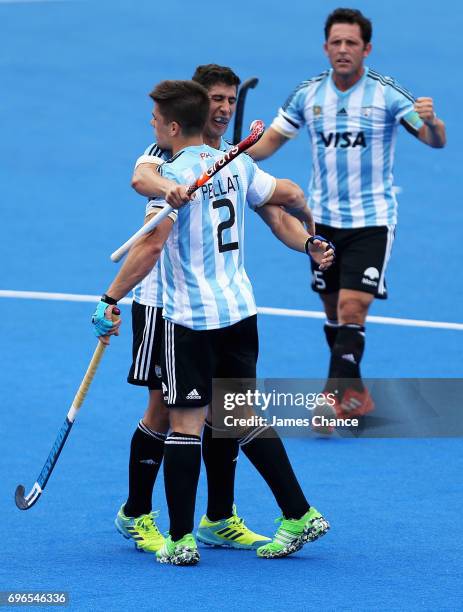 Gonzalo Peillat of Argentina celebrates scoring with his team mate Ignacio Ortiz of Argentina during the Pool A match between Korea and Argentina on...