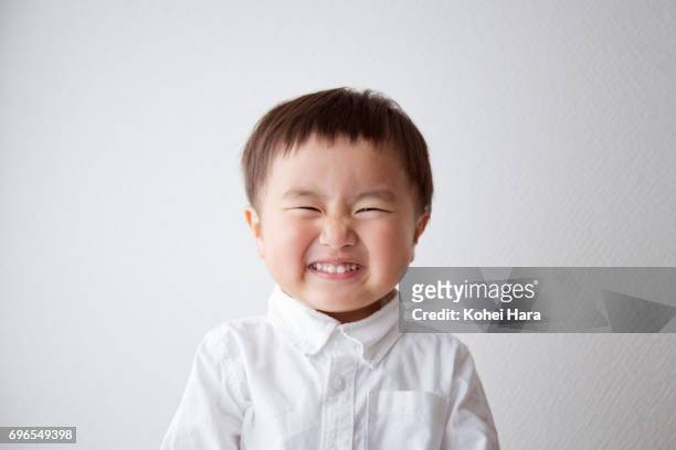 portrait of smiling boy - toothy smile stock pictures, royalty-free photos & images