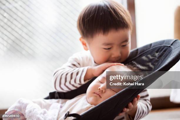 Boy taking care of baby