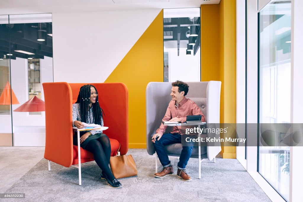 Work colleagues having meeting in creative office