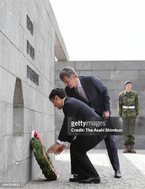 Crown Prince Naruhito of Japan and Crown Prince Frederik of Denmark offer a wreath at the Monument for Denmark's International Effort on June 16,...