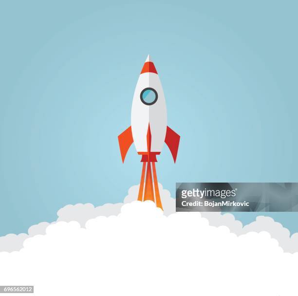 rocket ship launch. flat style. blue background - missile flame stock illustrations