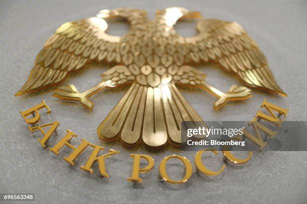 The crest of the Russian Federation sits on display at the headquarters of Bank Rossii, ahead of a news conference to announce interest rates in...