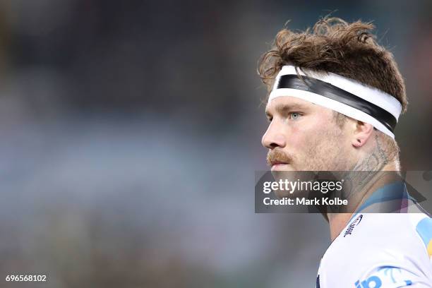 Chris McQueen of the Titans watches on during the round 15 NRL match between the South Sydney Rabbitohs and the Gold Coast Titans at ANZ Stadium on...