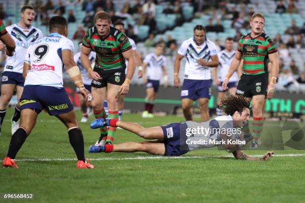 Kevin Proctor of the Titans scores a try during the round 15 NRL match between the South Sydney Rabbitohs and the Gold Coast Titans at ANZ Stadium on...
