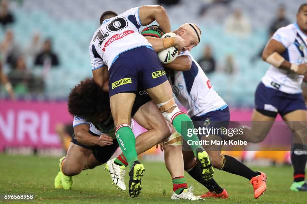 Jason Clark of the Rabbitohs is tackled during the round 15 NRL match between the South Sydney Rabbitohs and the Gold Coast Titans at ANZ Stadium on...