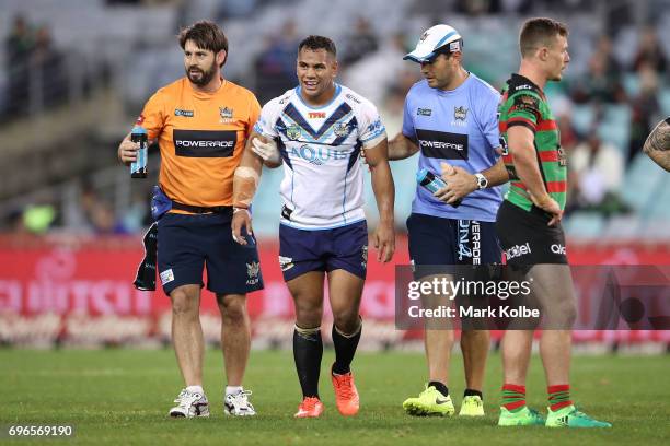 Patrick Politoni of the Titans leaves the filed with trainers during the round 15 NRL match between the South Sydney Rabbitohs and the Gold Coast...