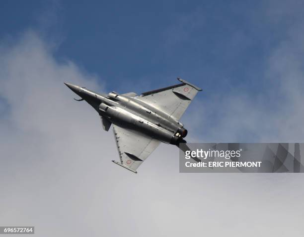 The Dassault Aviation Rafale jet fighter performs during a demonstration in Le Bourget on June 16, 2017 prior to the opening of the International...