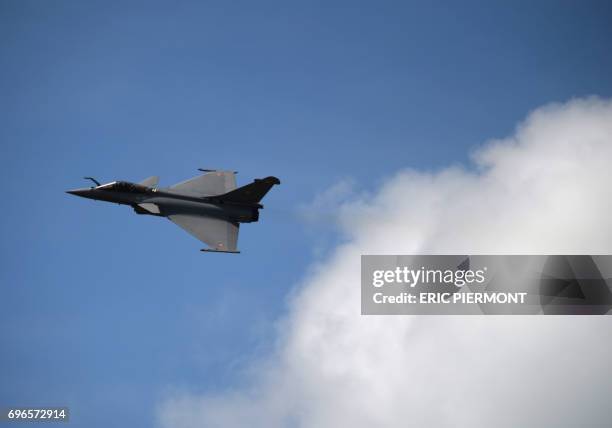 The Dassault Aviation Rafale jet fighter performs during a demonstration in Le Bourget on June 16, 2017 prior to the opening of the International...