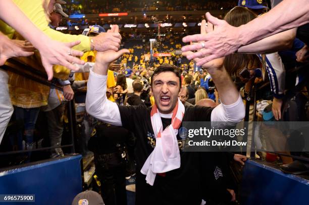 Zaza Pachulia of the Golden State Warriors high fives fans as he walks off the court after winning Game Five of the 2017 NBA Finals against the...