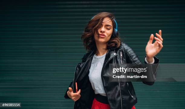 young girl dancing to the music - nodding head to music stock pictures, royalty-free photos & images