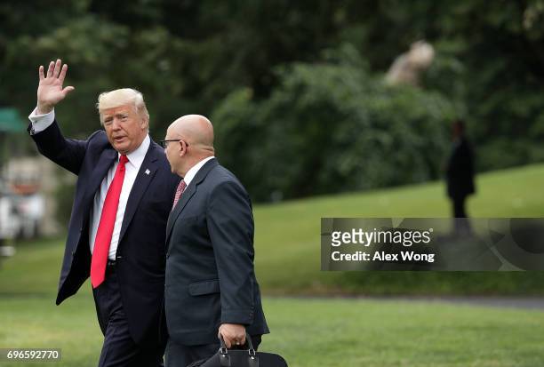 President Donald Trump and National Security Adviser H.R. McMaster walk on the South Lawn prior to a Marine One departure from the White House June...