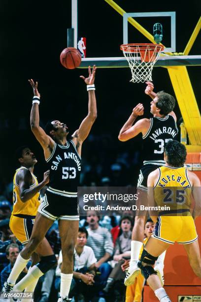 Artis Gilmore of the San Antonio Spurs rebounds against the Los Angeles Lakers circa 1985 at the Great Western Forum in Inglewood, California. NOTE...