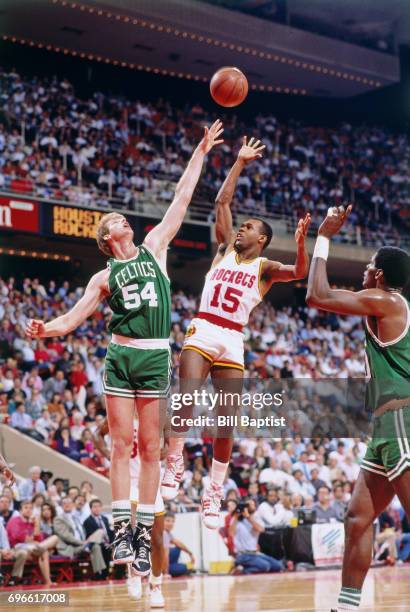 Mitchell Wiggins of the Houston Rockets shoots against the Boston Celtics during a game played circa 1988 at the Summit in Houston, Texas. NOTE TO...