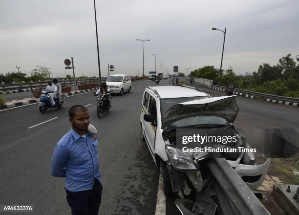 An Ola car meets with an accident as the driver of the cab was trying to save a biker during the heavy rain at Gita Colony Flyover, on June 16, 2017...