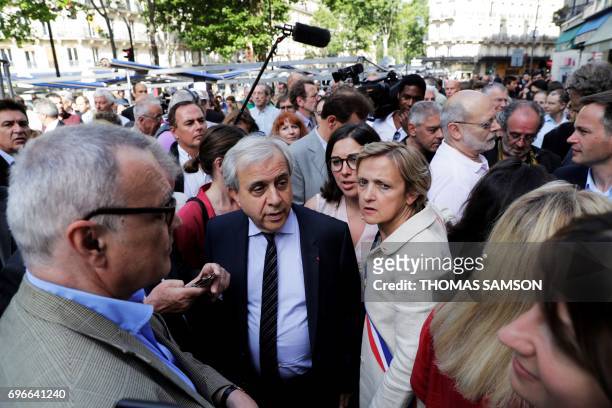 French right-wing Les Republicains party senator Roger Karoutchi and Mayor of Paris' 5th district Florence Berthout attend a demonstration on the...