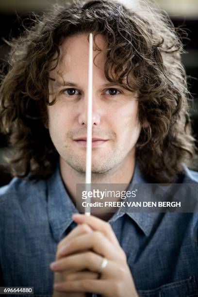 Great Britain's conductor Nicholas Collon poses in The Hague, on June 16 2017. Collon is the new chef-conductor of the Dutch orchestra for the season...