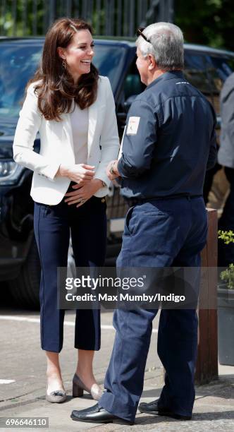 Catherine, Duchess of Cambridge is greeted by Sir Keith Mills as she visits the 1851 Trust roadshow at the Docklands Sailing and Watersports Centre...
