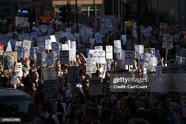 Protesters attending a rally calling for justice for those affected by the Grenfell Tower fire march toward Downing Street in Westminster on June 16,...
