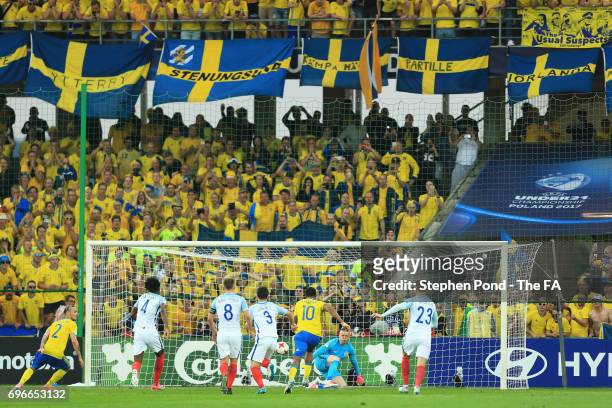 Goalkeeper Jordan Pickford of England saves a penalty from Linus Wahlqvist of Sweden during the UEFA European Under-21 Championship match between...