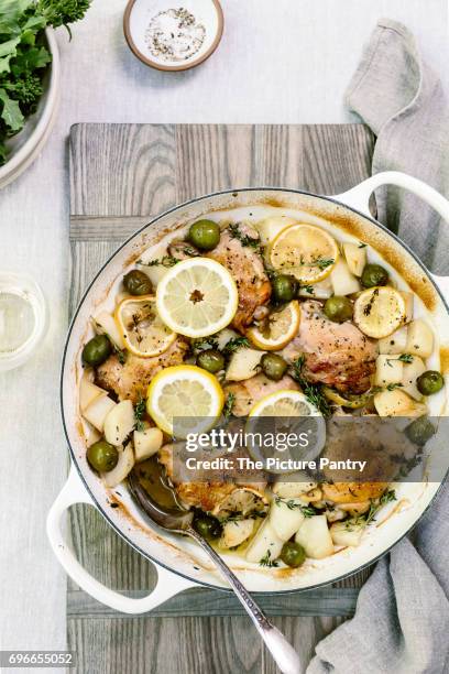 recipe for mediterranean lemon chicken with olives and potatoes - lemon chicken stock pictures, royalty-free photos & images