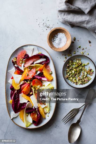 citrus fruit and chicory ricotta salata with pistachios - ricotta salata 個照片及圖片檔