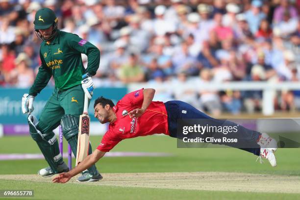 Ravi Bopara of Essex dives to field off his own bowling during the Royal London One-Day Cup Semi Final between Essex and Nottinghamshire at Cloudfm...