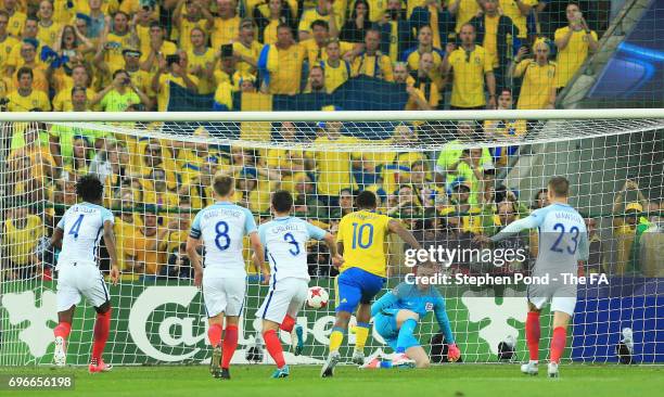 Goalkeeper Jordan Pickford of England saves a penalty from Linus Wahlqvist of Sweden during the UEFA European Under-21 Championship match between...