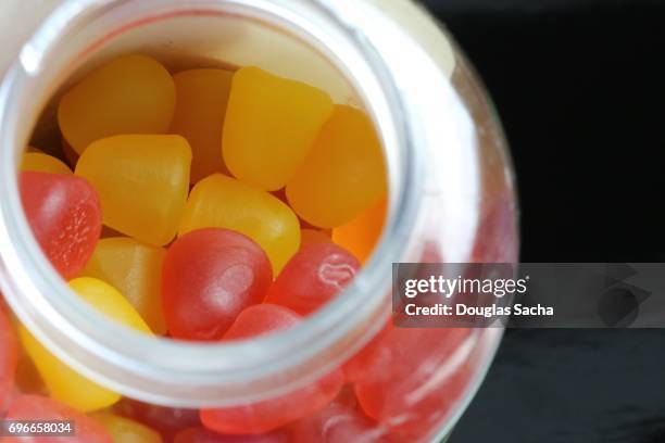 soft chew gummy pills for children - bonbon stock-fotos und bilder