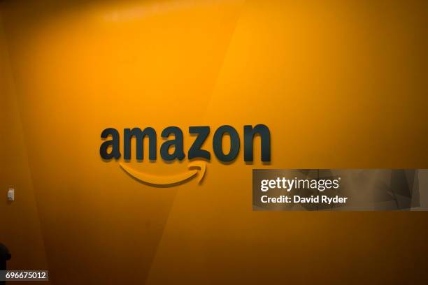 An Amazon logo is seen inside the Amazon corporate headquarters on June 16, 2017 in Seattle, Washington. Amazon announced that it will buy Whole...