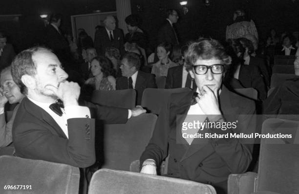 French fashion designer Yves Saint Laurent and his partner Pierre Bergé attend the first play by the writer François-Marie Banier at the Modern...